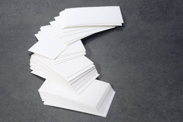 istock Blank white mock-up business cards on dark backgound table 1469638038