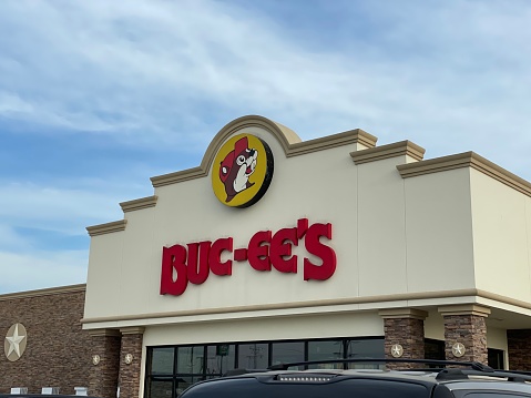 This is a photo of the Bucees logo on a storefront in Madisonville Texas.
