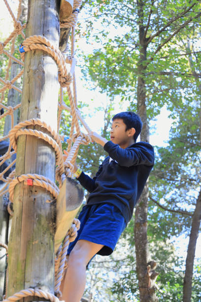 istock Japanese junior high school student playing with rope walking (13 years old) 1469641758