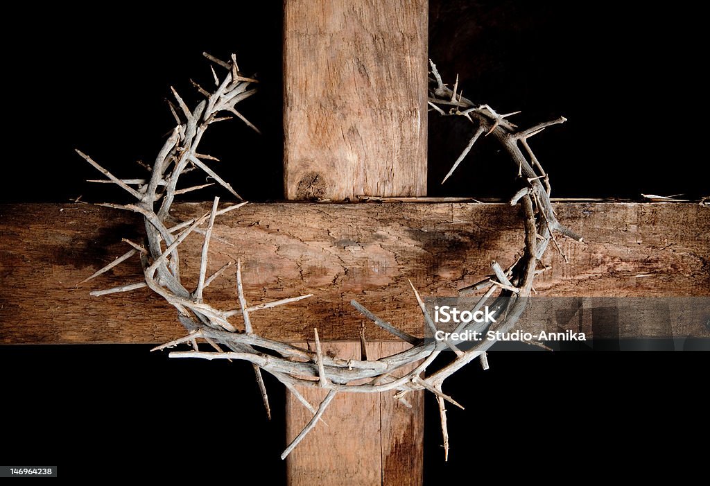 Cross and crown Crown of thorns hung around the Easter cross Crown Of Thorns Stock Photo