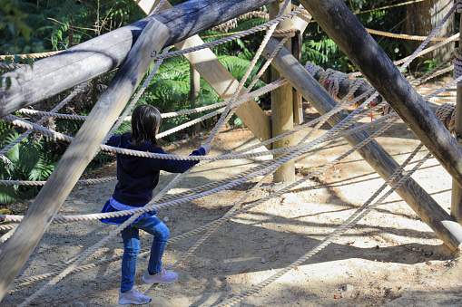 Japanese student girl playing with rope walking (8 years old)