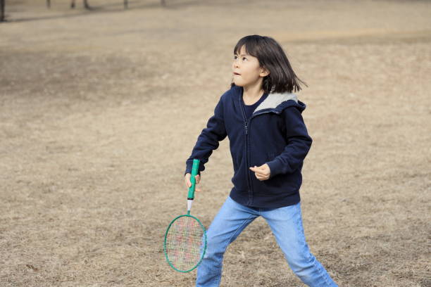 istock Japanese student girl playing badminton (8 years old) 1469644789