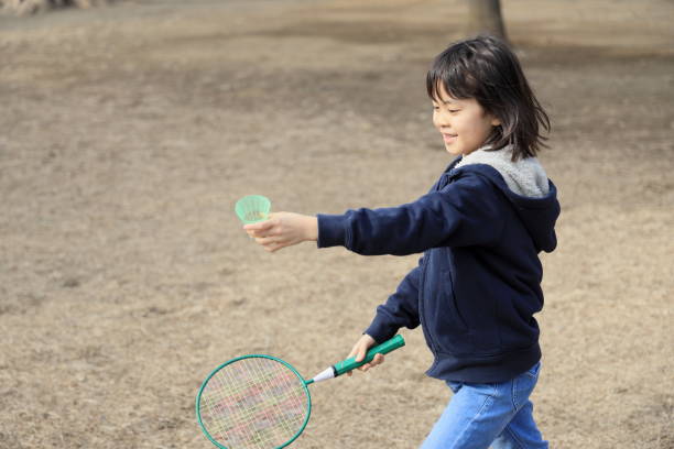 istock Japanese student girl playing badminton (8 years old) 1469644799