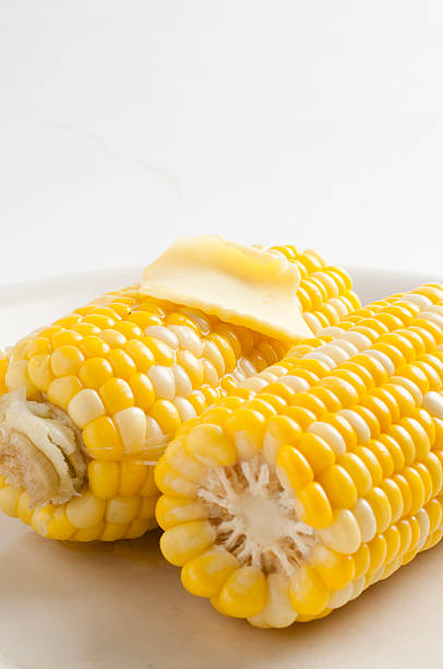 istock Sweet corn on plate with melted butter 146964992