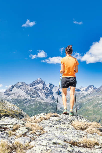 istock A young woman observes the view in the mountains 1469650080