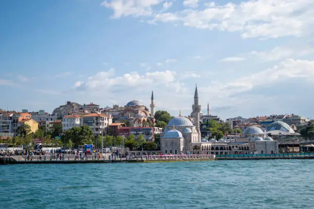 Istanbul, Turkey - June 29, 2023: Uskudar harbor and mosque in Istanbul, Turkey