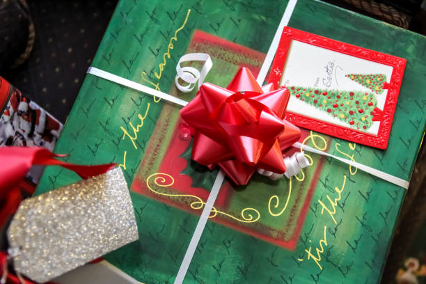 istock Christmas Present in a Green and Gold Box with Red Bow 1469654597