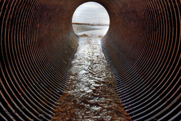 istock Ocean coast view seen through the drainage pipe 1469654895