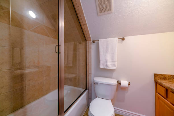 istock Utah- Bathroom interior with tub stall and sloped ceiling 1469655414