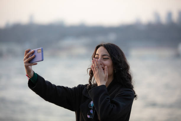 istock Young woman is taking a selfie in day time. 1469655621