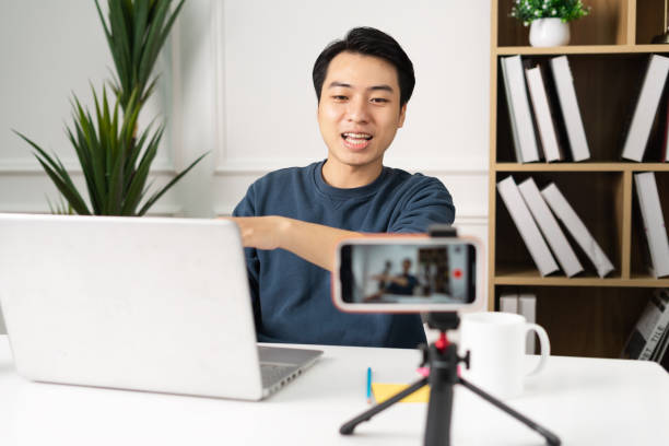 istock image of Asian man sitting at home working 1469656054