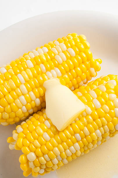 istock Sweet corn on plate with melted butter 146965779