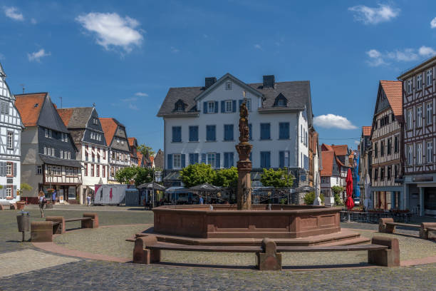 View of the historic market square with a fountain in Butzbach, Hesse, Germany. stock photo