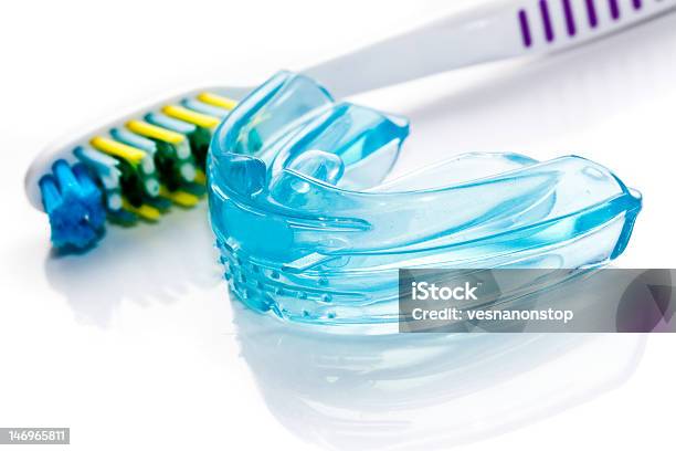 Dental Bracket And A Toothbrush Stock Photo - Download Image Now - Mouthguard, Dental Health, White Background