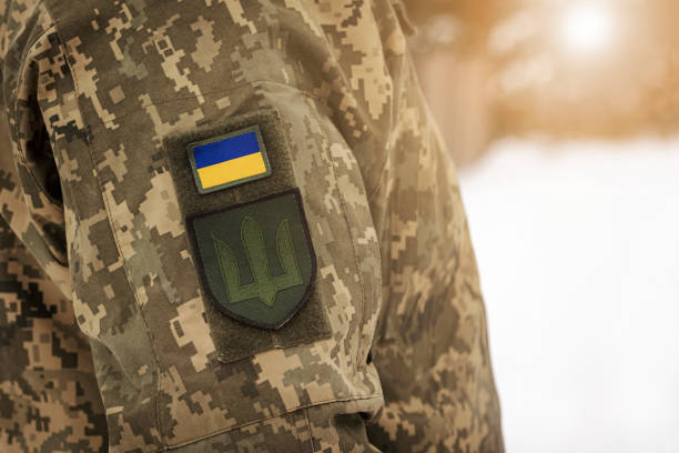 istock Ukrainian flag Symbol on Soldier Camouflage Uniform 1469660625