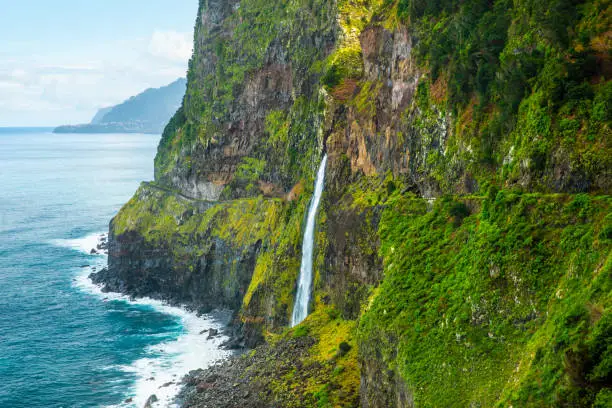 Photo of Beautiful view of Cascata do Veu da Noiva waterfall or Bridal Veil near Porto Moniz and Seixal. Madeira Island, Portugal