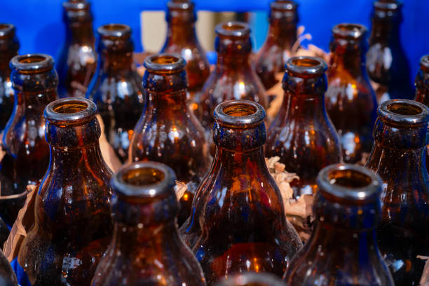 istock Empty beer dirty bottles in a drawer next to a cafe or bar, selective focus, material recycling and reuse of glass bottles 1469663423
