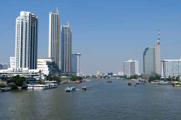 The Chao Praya River flowing at the Magnolia Waterfront Residences, 315m height and The Residences at Mandarin Oriental, Bangkok, 272 mt. part of Iconsiam, a mixed used development area in Bangkok, Thailand.