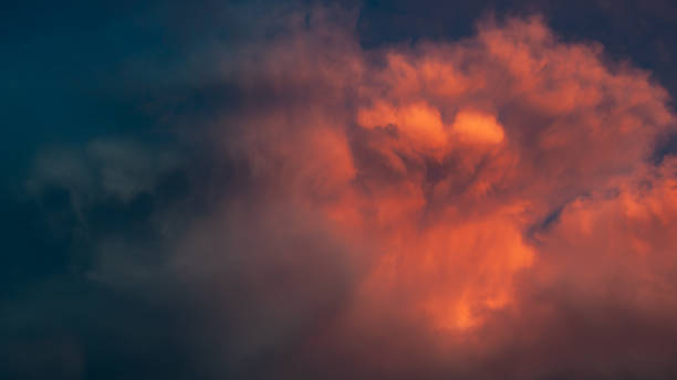 istock Dramatic clouds of red, gathering before the storm. 1469664386