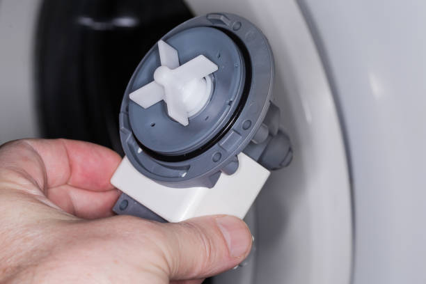 istock Drain pump assembly of modern washing machine in a hand 1469667004