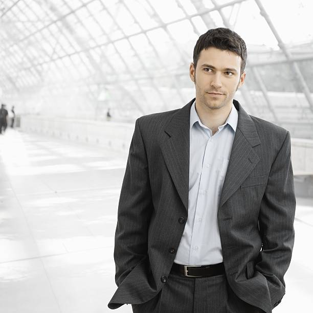 Businessman standing in office lobby