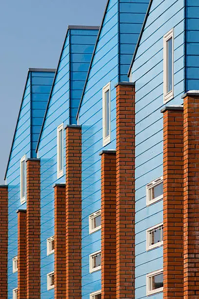 4 blue houses in 'compressed' perspective. These houses are located in Amersfoort (Zielhorst), The Netherlands.