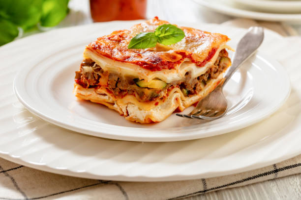 istock portion of Lasagna on white plate, top view 1469671023