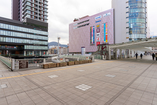 Kitakyushu, Japan - 29 Dec, 2022 : Day view of Kokura Station with people walking by in Kokura ,Kitakyushu, Japan on 29 Dec, 2022.