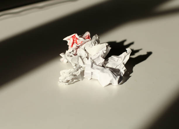 istock Several crumpled white checks on the table 1469674987