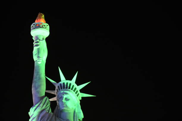 Parody of the Statue of Liberty with a funny mask along the High Line in New York during summer day.\nThis is from the artist Paoli Pivi,
