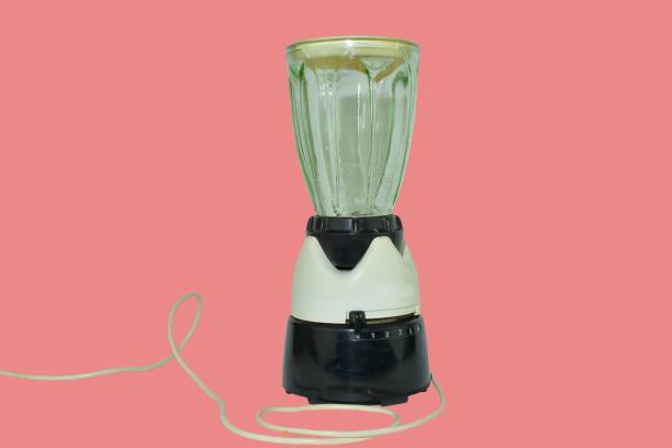 Retro electric blender isolated on very soft red background. Vintage blender from the late 1960's stock photo