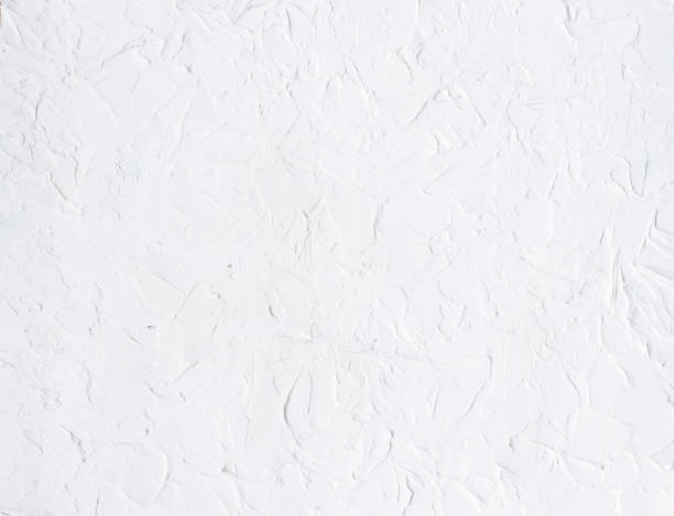 istock White abstract textured wall background. Light wallpaper background, textured putty, plaster. Copy space for the design. 1469676618