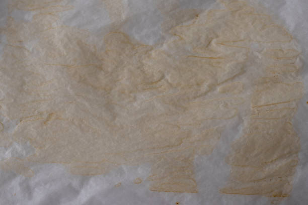 istock Old soiled used parchment for cooking. Background 1469676694