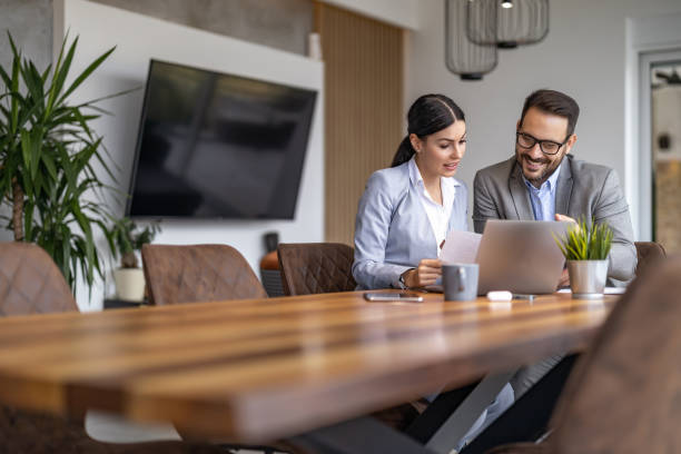 istock Business colleagues working together in modern office 1469684653