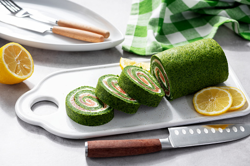 Spinach roll with smoked salmon and cream cheese. Healthy food.
