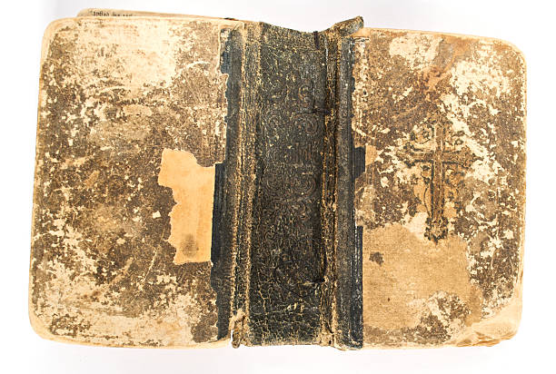 istock Grunge Antique Bible Cover Texture on White Background 146968637
