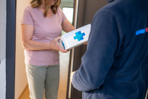 istock Shipping worker giving pharmacy order to customer 1469686704