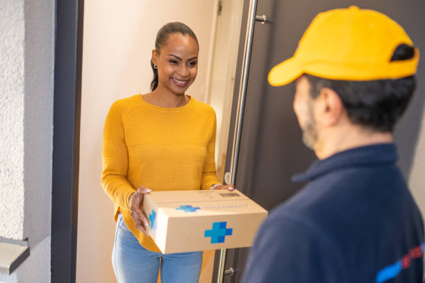 istock Deliveryman giving medications to customer 1469686714