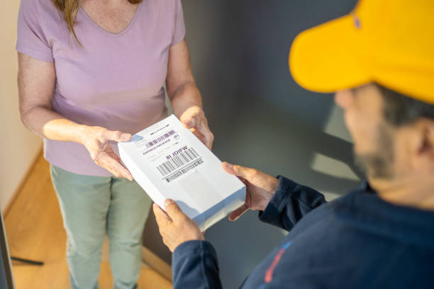 istock Shipping service worker giving pharmacy order 1469686718