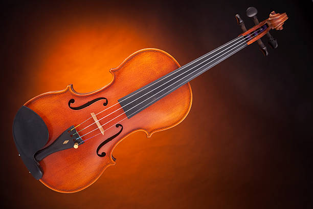 istock Violin Viola Isolated Against Gold 146968880
