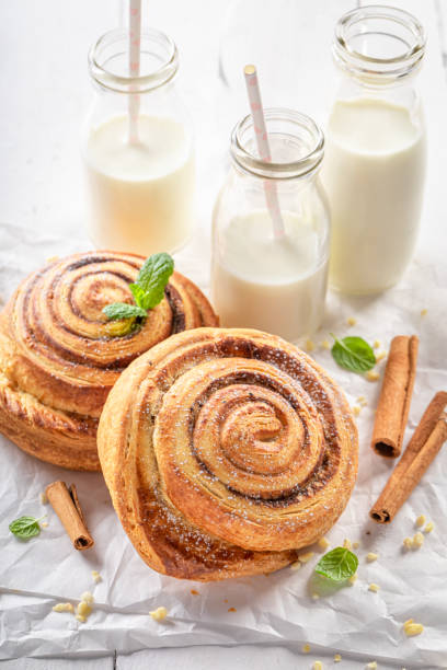 Fresh and traditionally cinnamon rolls with sugar and cinnamon. Fresh and traditionally cinnamon rolls with sugar and cinnamon. Scandinavian dessert. kanelbulle stock pictures, royalty-free photos & images