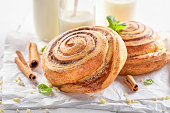 Fresh and traditionally cinnamon rolls served with milk.