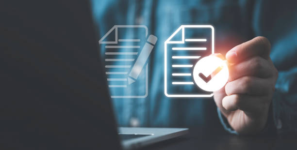 istock Businessman using electronic pen sign tick mark on virtual document for online approve paperless quality assurance and ERP management , Prepare check and approve concept. 1469698234
