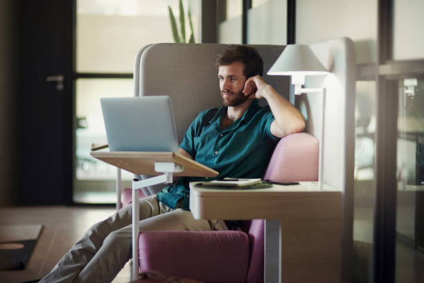 istock Laptop, remote work reading and business man at a worker productivity center working. Web design, internet analytics and businessman typing an email with technology at a desk planning a online job 1469698416