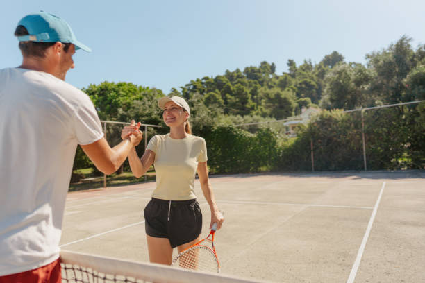 istock Loving couple playing tennis together 1469698634