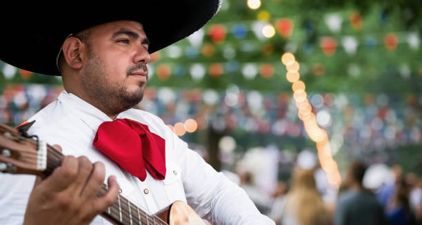 istock Mexican musician mariachi with guitar 1469698641