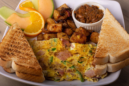 A Nutritious Breakfast with a Mix of Western and Asian Dishes on a Plate