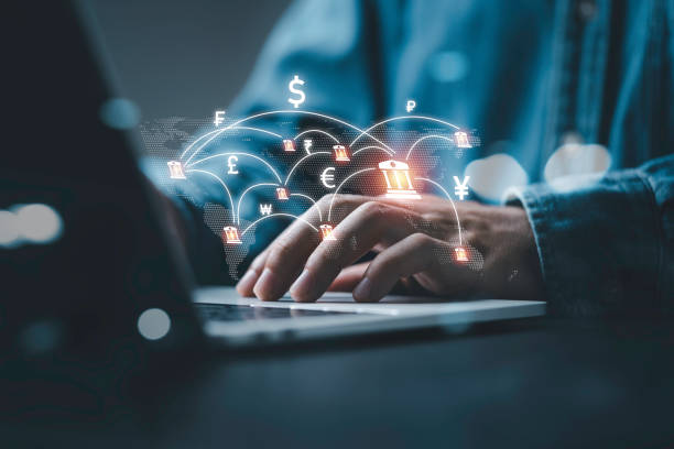 istock Businessman using computer virtual screen  with central banking and international currency include dollar Yuan Yen Pound sterling and Euro for forex and currency exchange money transfer concept. 1469719254