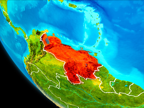 Venezuela highlighted in red on planet Earth with visible borders. 3D illustration. Elements of this image furnished by NASA.