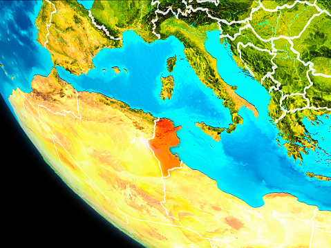 Tunisia highlighted in red on planet Earth with visible borders. 3D illustration. Elements of this image furnished by NASA.